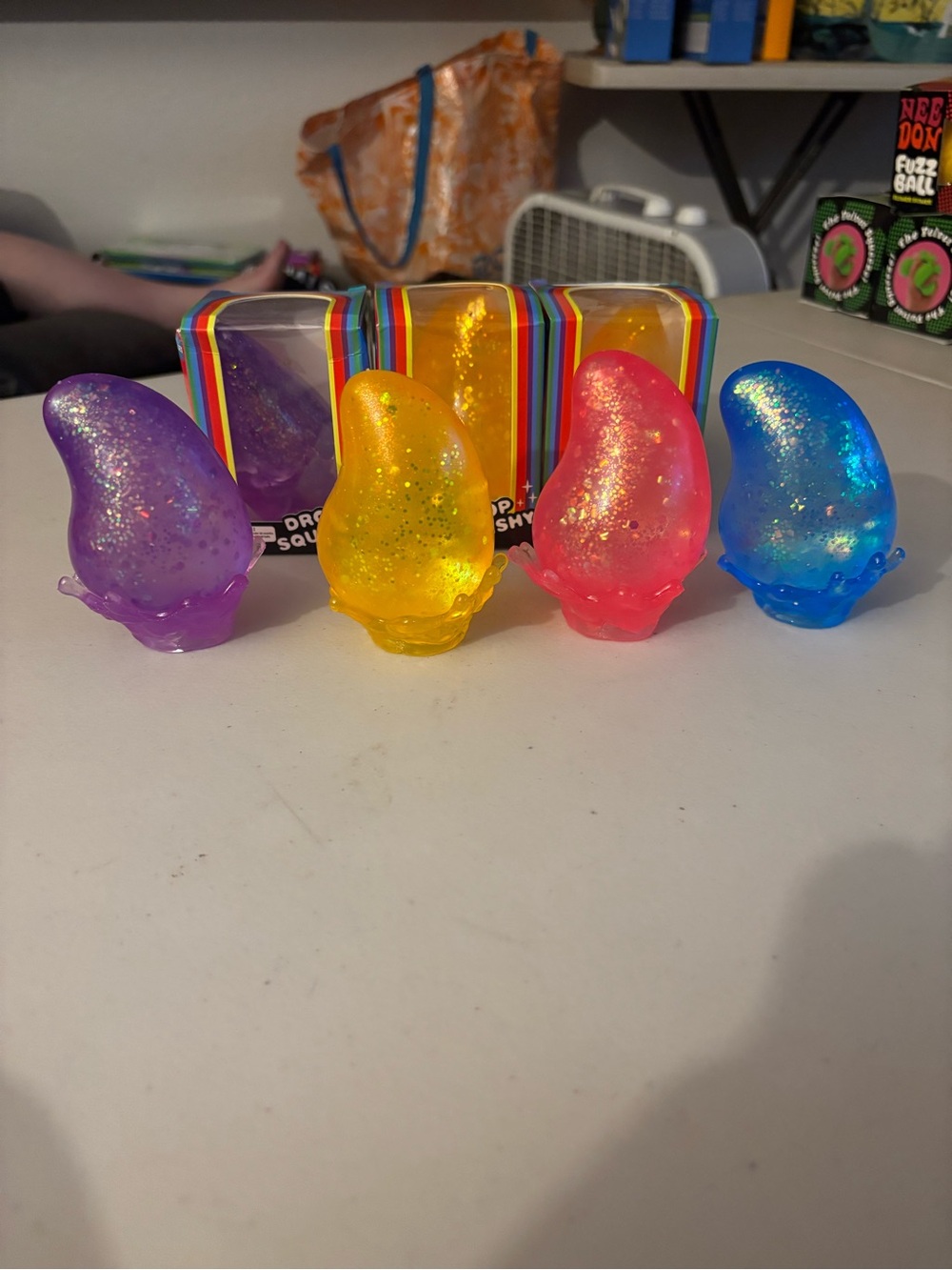 Glitter Drop Squishy Sensory Toy - Set of 4 (Purple, Yellow, Pink, Blue)